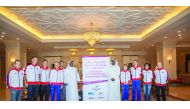 Abdullah Al Khater, Manager of Events at Aspire Zone Foundation poses for a photo with the British delegation which arrived in Doha yesterday to take part in the IAU 50km World Championship. The Championship will be held on Friday.