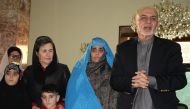 KABUL, AFGHANISTAN - NOVEMBER 09: Afghan president Ashraf Ghani welcomes Sharbat Gula and her children at presidential palace in Kabul, Afghanistan on November 9, 2016. Haroon Sabawoon - Anadolu Agency 
