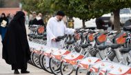 Morrocans inspect the recently installed Bicycle sharing system, known as 