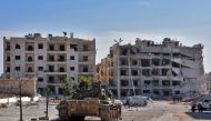 A general view shows a pro-government tank parked on a mainroad in Aleppo's western Minyan district on November 10, 2016. AFP / George Ourfalian