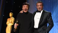 Honoree Jackie Chan (L) poses with actor Sylvester Stallone after Chan accepted his Honorary Oscar Award during the 8th Annual Governors Awards hosted by the Academy of Motion Picture Arts and Sciences at the Hollywood & Highland Center in Hollywood, Cali