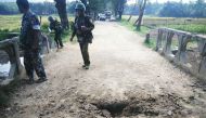 In this handout photograph released by the Myanmar Armed Forces on November 13, 2016, Myanmar soldiers view the crater from a landmine explosion on a bridge in Maung Nama Taung village of Maungdaw, located in Rakhine State near the Bangladesh border on No