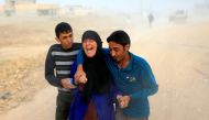 A displaced Iraqi woman cries after she finds out that her 15-year-old son Maitham was killed by an Islamic State mortar in Samah neighborhood, Mosul, Iraq November 13, 2016. REUTERS/Ahmed Jadallah