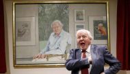 David Attenborough reacts next to a portrait of himself by Bryan Organ to mark his 90th birthday at New Walk Museum and Art Gallery in Leicester. Reuters