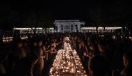 Tourists and locals light candles in the city centre to mark the beginning of the annual Yi Peng festival in the popular tourist city of Chiang Mai in the north of Thailand on November 13, 2016.   AFP / LILLIAN SUWANRUMPHA