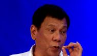 Philippine President Rodrigo Duterte gestures while delivering a speech during the 80th National Bureau of Investigation (NBI) founding anniversary at the NBI headquarters in metro Manila, Philippines November 14, 2016. REUTERS/Romeo Ranoco
