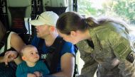 A Royal New Zealand Air Force member (R) helps evacuate a toddler and others aboard an NH90 helicopter from Kaikoura on the South Island of New Zealand November 15, 2016, stranded following the recent earthquakes. Sgt Sam Shepherd/Courtesy of Royal New Ze