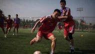 In a photo taken on September 22, 2016, students take part in an under-14 training session at the Pyongyang International Football School in Pyongyang. AFP / Ed Jones
