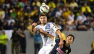 (FILES) This file photo taken on July 11, 2015 shows Steven Gerrard (L) of the LA Galaxy as he vies for the header with Jose Daniel Guerrero (R) of Club America in the ex-Liverpool and England international's debut for the MLS team during their 2015 Inter