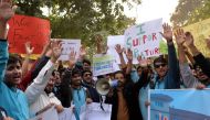 Pakistani students of the private PakTurk International Schools and Colleges shout slogans during a protest in Islamabad on November 17, 2016 against the Pakistani government's ordered deportation of 130 teachers. Pakistan has ordered the deportation of 1