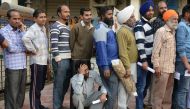 Indian people wait in a queue to deposit and exchange 500 and 1000 rupee notes outside a bank in Amritsar on November 17, 2016. Long queues formed outside banks in India since the government's shock decision to withdraw the two largest denomination notes 