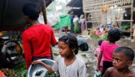A girl sells food at the internally displaced persons camp for Rohingya people outside Sittwe in the state of Rakhine, Myanmar, November 15, 2016. REUTERS/Soe Zeya Tun