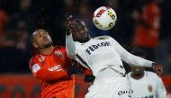 Lorient's Sylvain Marveaux (L) in action with Monaco's Tiemoue Bakayoko. REUTERS/Stephane Mahe
