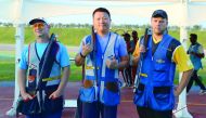 Ying Xu of China (centre) winner in the individual Skeet event at the 49th CISM World Military Shooting Championship poses for a picture along with silver medallist Jan Sychra of Czech Republic and Oskari Kossi of Finland at Losail Shooting Range yesterda