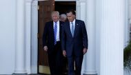 U.S. President-elect Donald Trump (L) and former Massachusetts Governor Mitt Romney (R) emerge after their meeting at the main clubhouse at Trump National Golf Club in Bedminster, New Jersey, U.S., November 19, 2016. REUTERS/Mike Segar