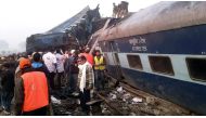 Indian rescue workers search for survivors in the wreckage of a train that derailed near Pukhrayan in Kanpur district on November 20, 2016. AFP 