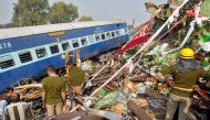 Rescue workers search for survivors at the site of a train derailment in Pukhrayan, south of Kanpur city, India November 20, 2016. REUTERS/Jitendra Prakash
