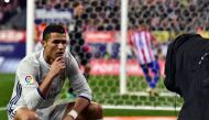 Real Madrid's Portuguese forward Cristiano Ronaldo poses in front of a TV camera as he celebrates after scoring during the Spanish league football match Club Atletico de Madrid vs Real Madrid CF at the Vicente Calderon stadium in Madrid, on November 19, 2