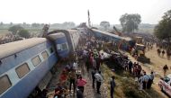 Rescue workers search for survivors at the site of a train derailment in Pukhrayan, south of Kanpur city, India November 20, 2016. REUTERS/Jitendra Prakash
