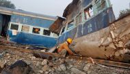 A railway employee cuts a railway track at the site of Sunday's train derailment in Pukhrayan, south of Kanpur city, India, November 21, 2016. REUTERS/Jitendra Prakash