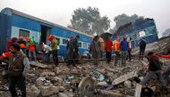 Rescue workers search for survivors at the site of Sunday's train derailment in Pukhrayan, south of Kanpur city, India November 21, 2016. REUTERS/Jitendra Prakash