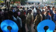 Indian customers queue to withdraw money from a State Bank of India ATM in Siliguri on November 21, 2016. Frustration is mounting in India over a cash crisis triggered by the withdrawal of all high-value notes from circulation. The shock November 8 move, 