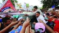 Venezuela's President Nicolas Maduro greets supporters as he arrives for his weekly broadcast 