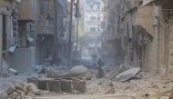 Collapsed buildings are seen after war crafts belonging to the Syrian and Russian army carried out airstrikes over residential areas at the As-Sukkari district of Aleppo, Syria on November 21, 2016. ( Jawad al Rifai - Anadolu Agency )