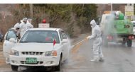 South Korean health officials disinfect a vehicle to prevent spread of bird flu in Pocheon, South Korea, November 23, 2016. Kim Myeong-jin/News1 via REUTERS
