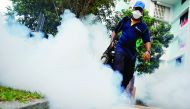 A worker fogs the common area of a public housing estate at a new Zika cluster in Singapore September 1, 2016. REUTERS/Edgar Su