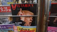 A magazine featuring a cover story about US President-elect Donald Trump is seen at a news stand in Beijing on November 23, 2016. AFP / GREG BAKER
