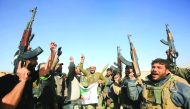 Fighters from the Hashed Al Shaabi (Popular Mobilisation) react as they enter the village of Al Tofaha, southeast of the city of Tal Afar, yesterday, during an ongoing operation against Islamic State (IS) militants. 