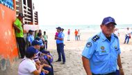 Police officers and residents of the Masacahapa seaside resort in the San Rafael del Sur municipality, Nicaragua. Central America suffered a hurricane and offshore earthquake yesterday, triggering alarm in Nicaragua, El Salvador and Costa Rica.