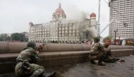 Indian army soldiers take position during a gun battle at the Taj Mahal hotel in Mumbai November 29, 2008. Reuters