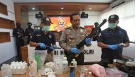 Indonesian police show items recently seized, including weapons and bomb-making materials, that they say were intended for use to attack government buildings and the Myanmar embassy, at police headquarters in Jakarta, Indonesia November 25, 2016 in this p