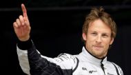 FILE PHOTO - Brawn GP Formula One driver Jenson Button of Britain waves after qualifying in pole position for the Spanish F1 Grand Prix at the Catalunya racetrack in Montmelo, near Barcelona, May 9, 2009. REUTERS/Dani Cardona/File Photo
