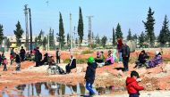 Syrians who evacuated the eastern districts of Aleppo are gathered in a government-held area in Aleppo, yesterday.