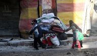 Residents escape from the scene of the air strikes carried out by the war crafts belonging to Russia and Assad regime forces in al-Shear neighbourhood of Aleppo, Syria on November 28, 2016. ( Mamun Ebu Ömer - Anadolu Agency )
