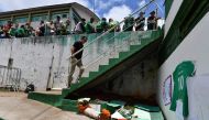 People pay tribute to the players of Brazilian team Chapecoense Real who were killed in a plane accident in the Colombian mountains, at the club's Arena Conda stadium in Chapeco, in the southern Brazilian state of Santa Catarina, on November 29, 2016.  AF