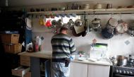 Elad Ziv prepares food in his home in the Jewish settler outpost of Amona in the West Bank, November 22, 2016. Picture taken November 22, 2016. REUTERS/Ronen Zvulun