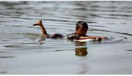 A child swims in a river in Dhaka, Bangladesh November 28, 2016. (REUTERS/Mohammad Ponir Hossain)