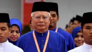 Malaysian Prime Minister Najib Razak (R) arrives to address the annual congress of his ruling party, the United Malays National Organisation (UMNO) in Kuala Lumpur on December 1, 2016. AFP / MANAN VATSYAYANA