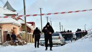 An armed policeman guards as the police experts examine crime scene in the small town of Knyazychy, some 30 kilometres east of Kiev, on December 4, 2016.
Five Ukrainian police were killed by friendly fire on December 4, 2016 in a deadly accident at a cri