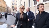 Francesca Pascale (L), fiancee of Italy's former Prime Minister Silvio Berlusconi, leaves a polling station after voting for a referendum on constitutional reforms, on December 4, 2016 in Rome. Italians began voting today in a constitutional referendum on