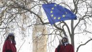 Protesters wearing judges' wigs and robes ride an open top bus past the Supreme Court ahead of the challenge against a court ruling that Theresa May's government requires parliamentary approval to start the process of leaving the European Union, in Parlia