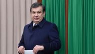 Uzbek acting President Shavkat Mirziyoyev leaves a voting booth to cast his ballot for the presidential election in Tashkent on December 4, 2016.  AFP / POOL / Anvar Ilyasov
