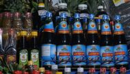 Bottles of fish sauce (in blue) are displayed for sale at a stand inside a local market in downtown Hanoi on Nov 21, 2016. PHOTO: AFP 