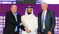 The Secretary-General of Supreme Committee for Delivery and Legacy, Hassan Al Thawadi, presenting the first Duncan Revie Award to Chairman of Sheffield FC, Richard Tims, during the opening ceremony of the Soccerex Asian Forum at the Grand Hyatt Hotel in D