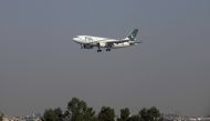FILE PHOTO - A Pakistan International Airlines (PIA) passenger plane arrives at the Benazir International airport in Islamabad, Pakistan December 2, 2015. REUTERS/Faisal Mahmood/File Photo
