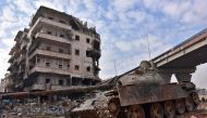 Syrian government troops patrol the newly captured al-Sakhour neighbourhood in the eastern part of the northern city of Aleppo on December 7, 2016. Rebels in Aleppo called for a five-day truce and the evacuation of civilians after losing more than three q